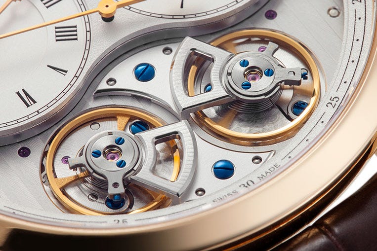 Two balances provide regulation for each side of the dial, each powered by its own mainspring